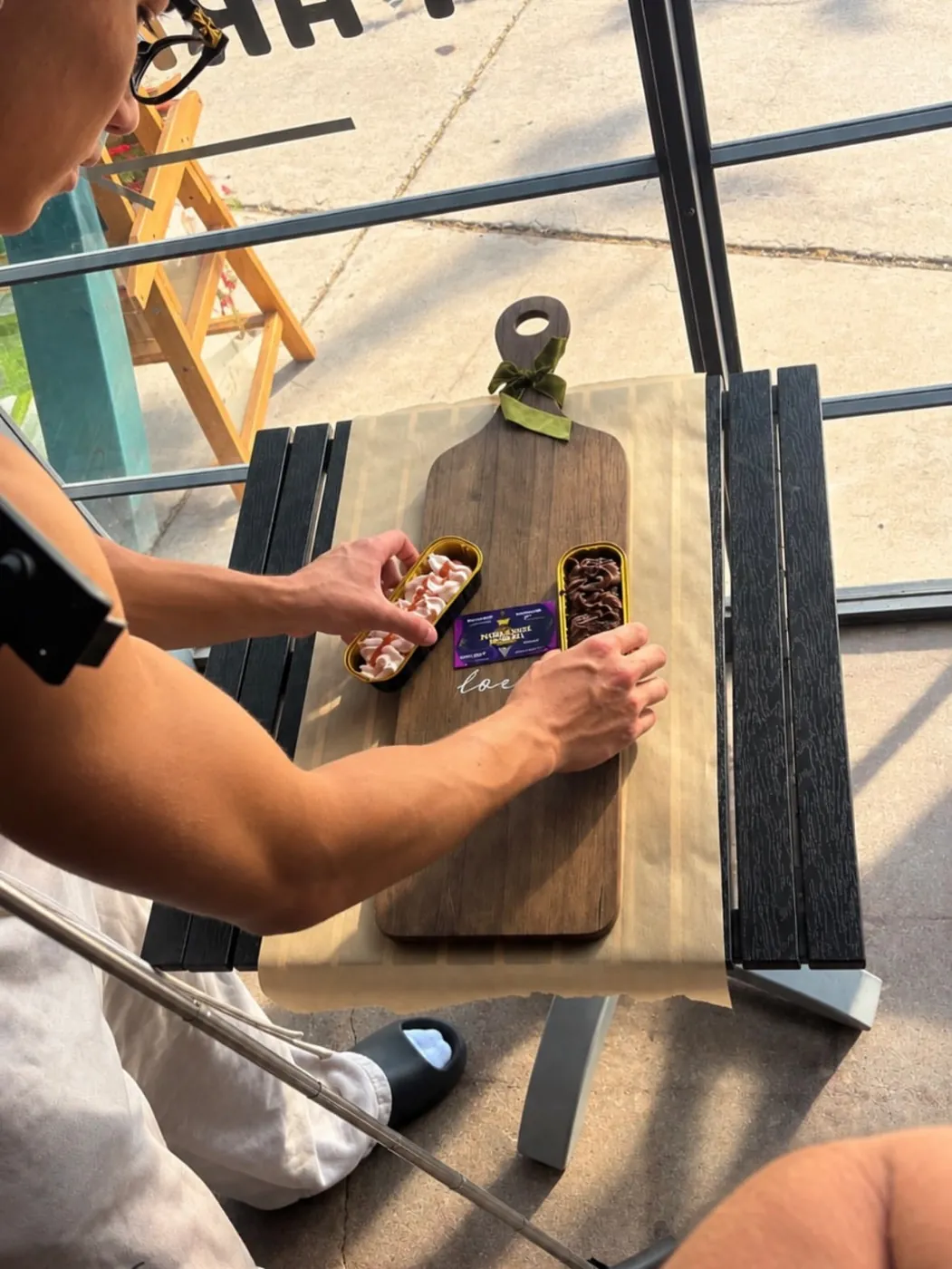 Styling dessert tins on a wooden board for an overhead product photo