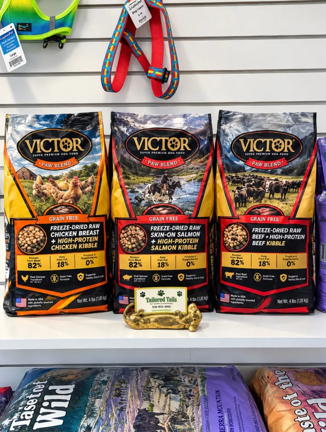 Premium dog food bags displayed with a Tailored Tails business card