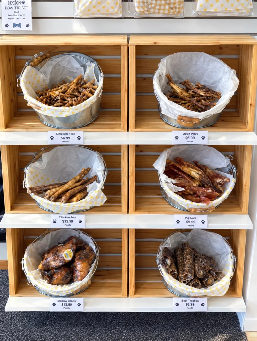 Natural dog treats in lined baskets on wooden crate shelving